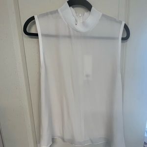 Sheer white sleeveless top with tie for front or back.  Zipper close at neck.